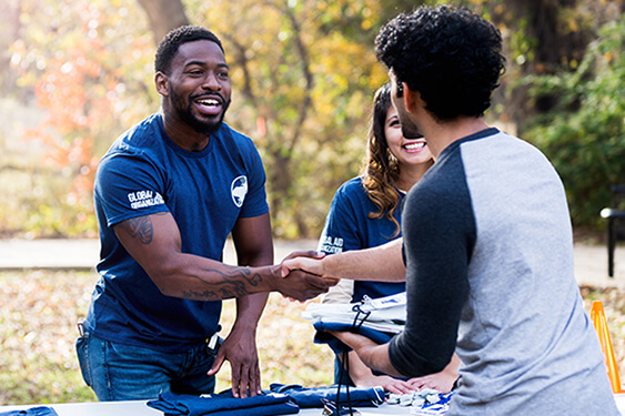 image of man and woman volunteering at a food bank